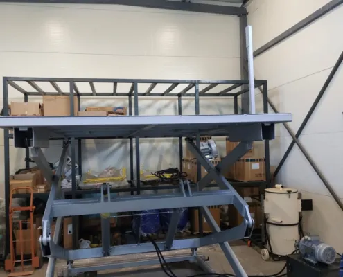 Raised platform with visible scissor arms and cylinders