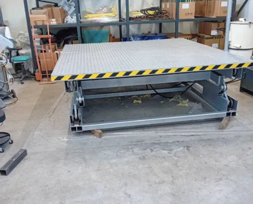 Scissor lift platform with checker plate deck, front view