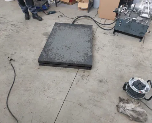 Smaller platform lowered next to its power unit