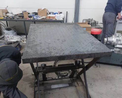 Work on a small scissor lift platform